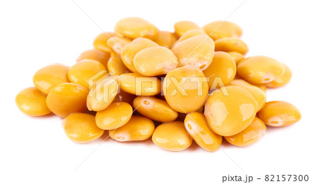 Pickled yellow lupine beans isolated on white background. Tournus, preserved lupinus. 82157300