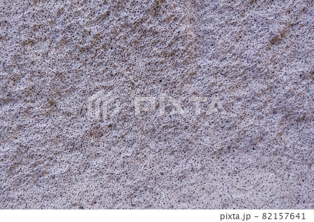 View of the gray texture of the concrete wall of the building, background. View of the gray texture of the concrete wall of the building, background. 82157641