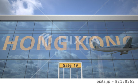 HONG KONG text revealed with landing airplane on airport building. 3d rendering 82158565
