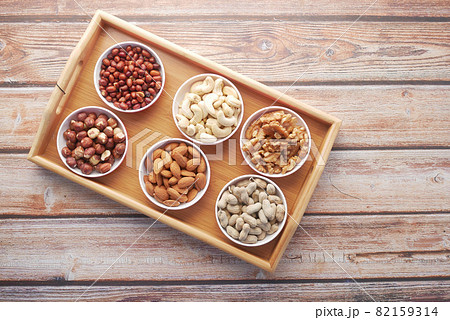 peanut, hazelnut walnut , cashew nut and almond in a container  82159314