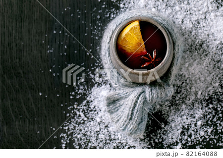 Hot mulled wine with spices and Christmas decorations Hot mulled wine with spices and Christmas decorations 82164088