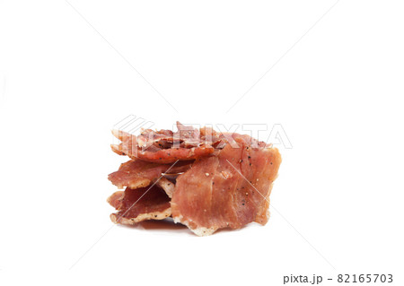 Pieces of jerky are stacked on a white background. Isolate. Pieces of jerky are stacked on a white background. Isolate. 82165703