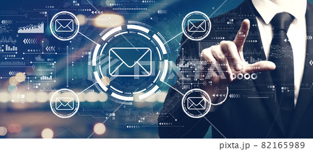 Email concept with a man on city background 82165989