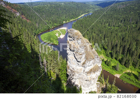 The picturesque Devil's Finger rock overlooking the Usva River. Massif Usvinskie Pillars. Perm Territory. Russia The picturesque Devil's Finger rock overlooking the Usva River. Massif Usvinskie Pillars. Perm Territory. Russia 82168030