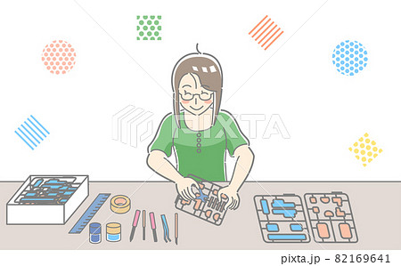プラモデルを作っている人物のイラスト素材