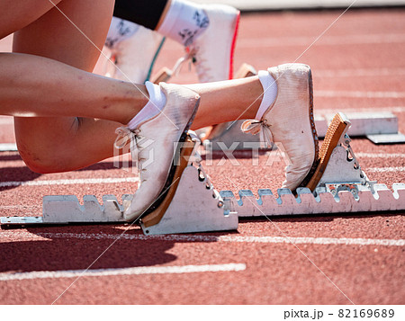 view of female feet on starting block ready for a sprint start view of female feet on starting block ready for a sprint start 82169689