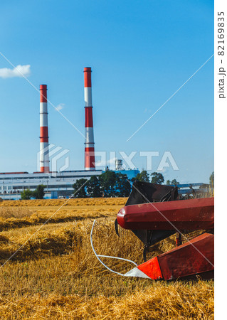 Close up of combine harvester harvesting wheat Close up of combine harvester harvesting wheat 82169835