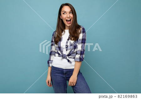 Young beautiful brunet woman. Trendy lady in casual summer hipster shirt . Positive female shows 82169863