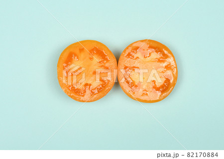 Yellow tomato isolated on blue Yellow tomato isolated on blue 82170884