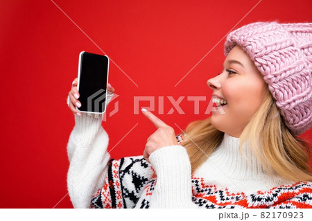 Photo of beautiful smiling young woman good looking wearing casual stylish outfit standing isolated 82170923