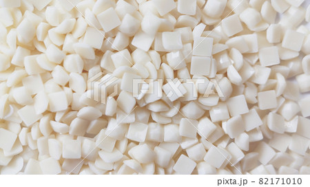 Close-up, white square diamonds for diamond embroidery. Hobbies and DIY, materials for creating diamond embroidery Close-up, white square diamonds for diamond embroidery. Hobbies and DIY, materials for creating diamond embroidery 82171010