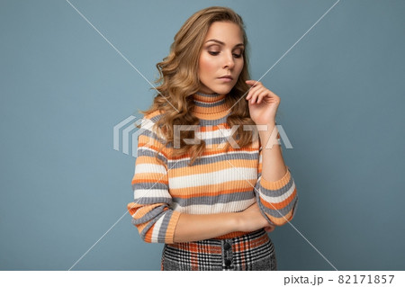 Photo portrait of young pretty beautiful thoughtful blonde woman with sincere emotions wearing 82171857