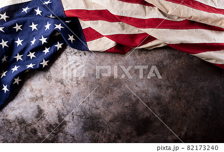 Happy Veterans Day concept. American flags against a dark stone  background. November 11. 82173240