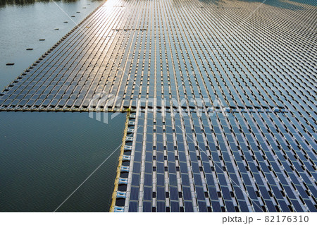 Aerial view of lake in renewable alternative electricity on floating solar panels platform Aerial view of lake in renewable alternative electricity on floating solar panels platform 82176310