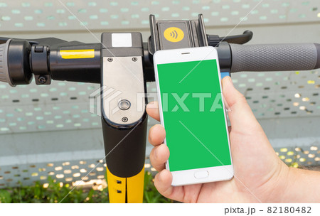smartphone screen and electric scooter. Rent an street transport. smartphone screen and electric scooter. Rent an street transport. 82180482