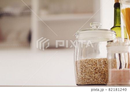 Food products in glass jars in the kitchen, pasta, cereal, salt, wine, groceries Food products in glass jars in the kitchen, pasta, cereal, salt, wine, groceries 82181240