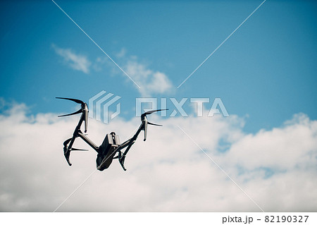 New York, USA - SEPTEMBER 18, 2021: DJI Inspire 2 quadcopter drone on ground before aerial flight and filming. New York, USA - SEPTEMBER 18, 2021: DJI Inspire 2 quadcopter drone on ground before aerial flight and filming. 82190327
