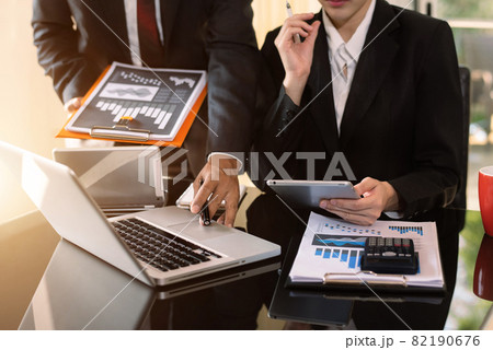 Business team meeting present.professional investor working with new startup project. Finance managers task.Digital tablet laptop computer design smart phone in morning light. 82190676