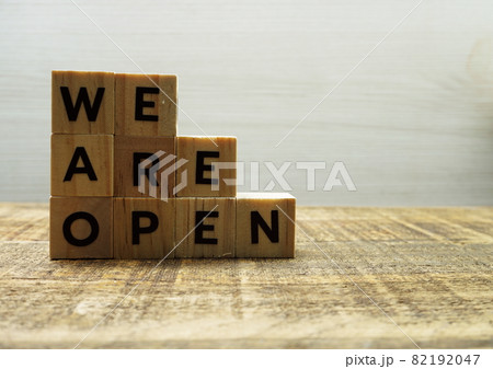 We are open alphabet letters with space copy on wooden background We are open alphabet letters with space copy on wooden background 82192047
