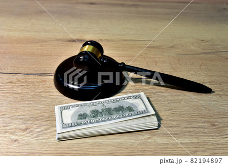 Judge hammer and bundles of dollars. Justice in courtroom. Judge hammer and bundles of dollars. Justice in courtroom. 82194897