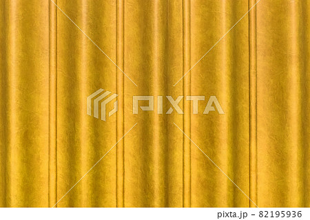 Sliding door, yellow curtain scene from the leather of the conference room in the hotel. Wavy abstract pattern wall texture background 82195936