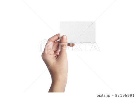 Female hand holding visit card on pure white background. 82196991
