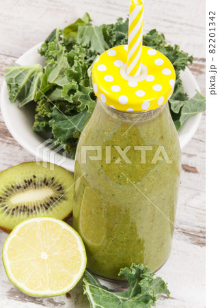 Freshly blended green coctail from fruits and vegetables as healthy dessert containing vitamins 82201342