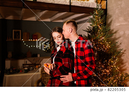 Love, christmas, couple, proposal concept - happy man giving diamond engagement ring to woman Love, christmas, couple, proposal concept - happy man giving diamond engagement ring to woman 82205305