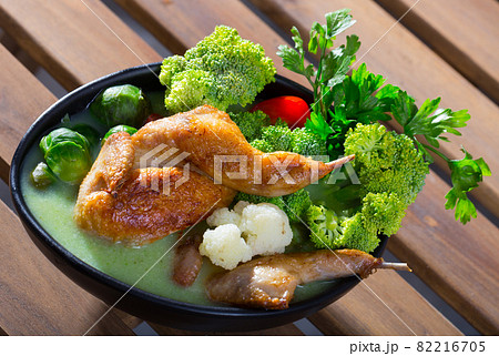 Tasty soup with quail, brussels sprouts, broccoli, and cauliflower 82216705