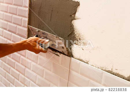 House renovation, Laying ceramic tles on the wall. House renovation, Laying ceramic tles on the wall. 82218838