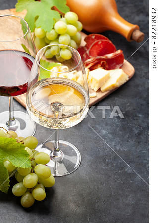 White and red wine glasses, grape and appetizer board White and red wine glasses, grape and appetizer board 82218932