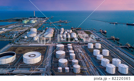 Aerial view oil terminal storage tank, White oil tank storage chemical petroleum petrochemical refinery product at oil terminal, Business commercial trade fuel and energy transport by tanker ship Aerial view oil terminal storage tank, White oil tank storage chemical petroleum petrochemical refinery product at oil terminal, Business commercial trade fuel and energy transport by tanker ship 82220365