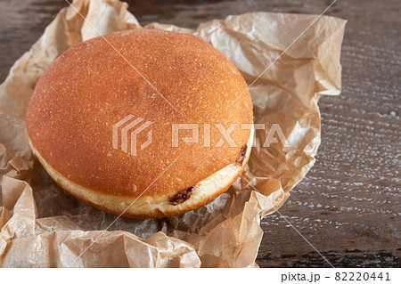 Chocolate beignets on rustic background Chocolate beignets on rustic background 82220441