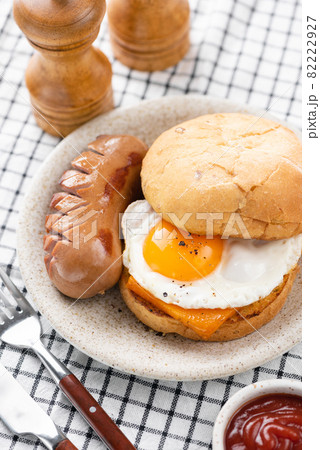 Breakfast sandwich with fried egg, cheese, sausage Breakfast sandwich with fried egg, cheese, sausage 82222927