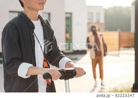 Unrecognizable Woman Riding Scooter 82223247