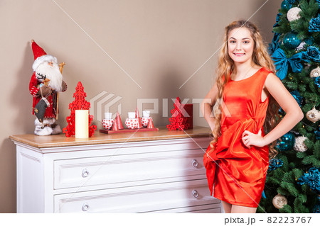 Beautiful long haired cute blonde girl, looking at camera, and posing. 82223767