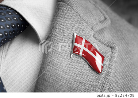 Metal badge with the flag of Denmark on a suit lapel 82224709