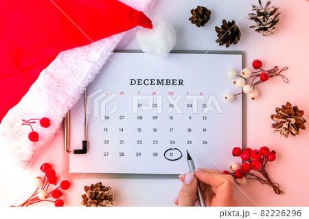 New year and christmas decorations flat lay. Top view. Calendar december month. Planning holidays. New year party. New year and christmas decorations flat lay. Top view. Calendar december month. Planning holidays. New year party. 82226296