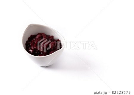 Beetroot sauce in white bowl 82228575