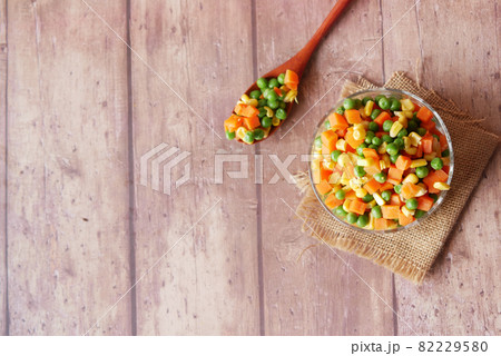 corn, carrot and beans in a bowl on table  82229580