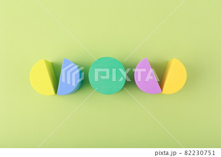 Trendy creative composition with multicolored circles against light green background Trendy creative composition with multicolored circles against light green background 82230751