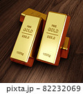 Gold bars on a wood floor 3d render. 82232069