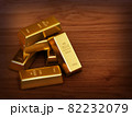 Gold bars on a wood floor 3d render. 82232079