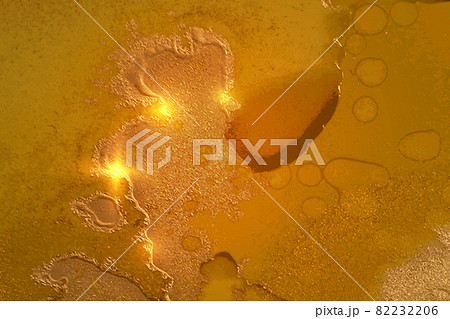 Dark yellow and gold abstract pattern with marble texture and sparkles 82232206