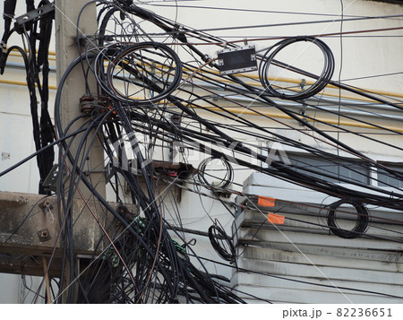 Many electrical cable, wire, telephone line and CCTV on electricity pole 82236651