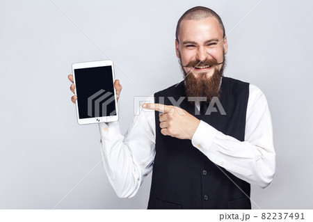 emotional man in suit on gray background emotional man in suit on gray background 82237491