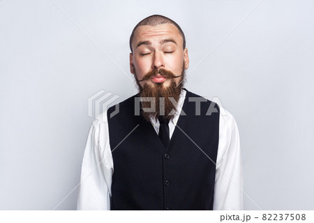 emotional man in suit on gray background 82237508