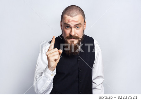 emotional man in suit on gray background 82237521