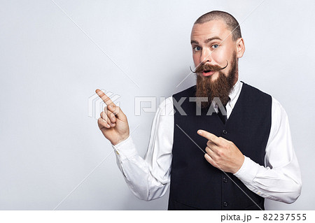 emotional man in suit on gray background emotional man in suit on gray background 82237555