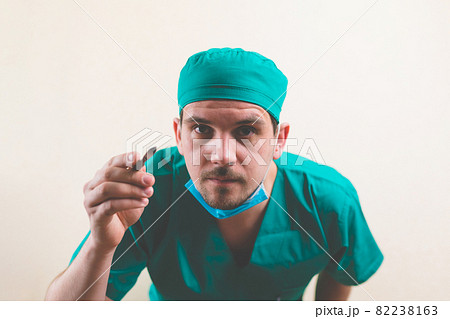 Focused doctor with lancet 82238163